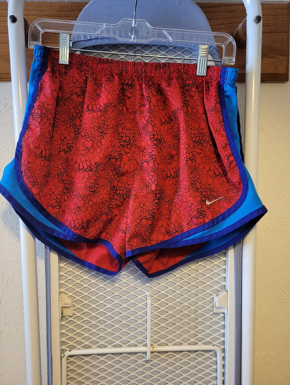 Nike Women's Red Patterned Athletic Shorts with Blue Trim and Black Detail